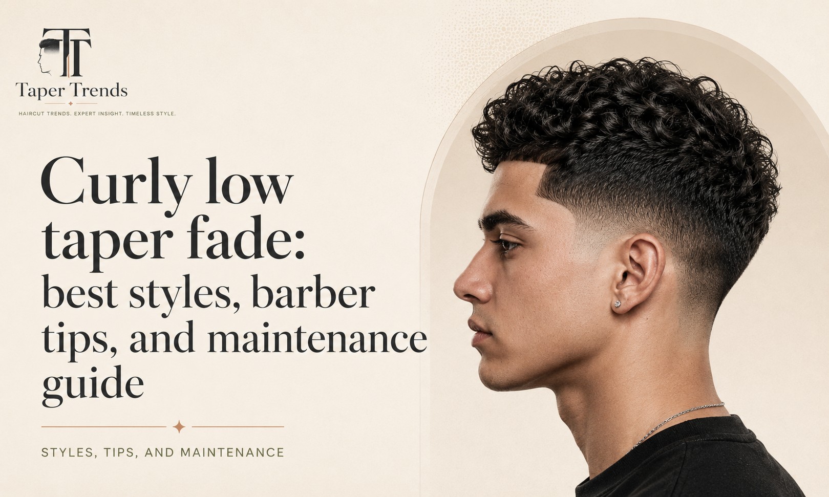 Curly low taper fade — natural curl length and volume kept on top over sides that fade low and clean around the ears and neckline.